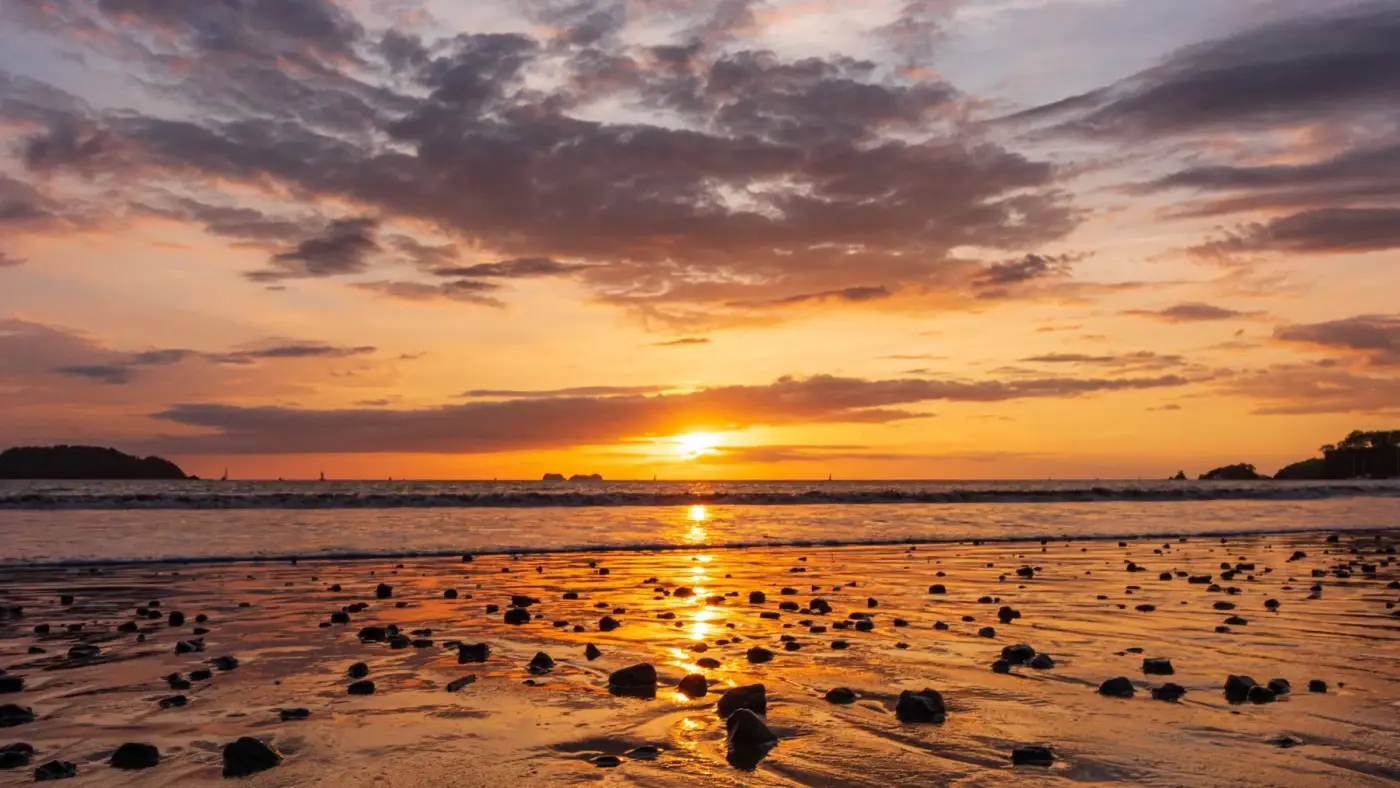 Sunset with layered clouds over a beach on the Guanacaste coast, Costa Rica