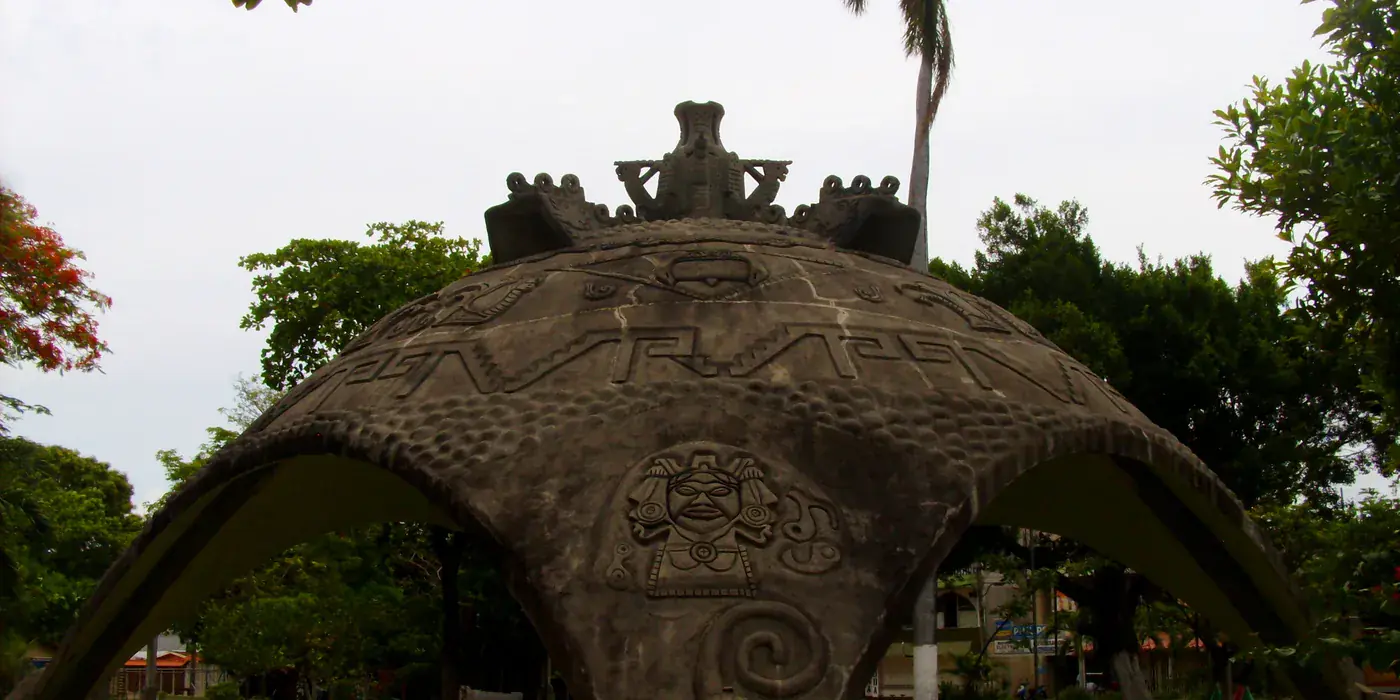 The white bandstand kiosk in the central park at Santa Cruz, Guanacaste, with palms and low buildings around the square